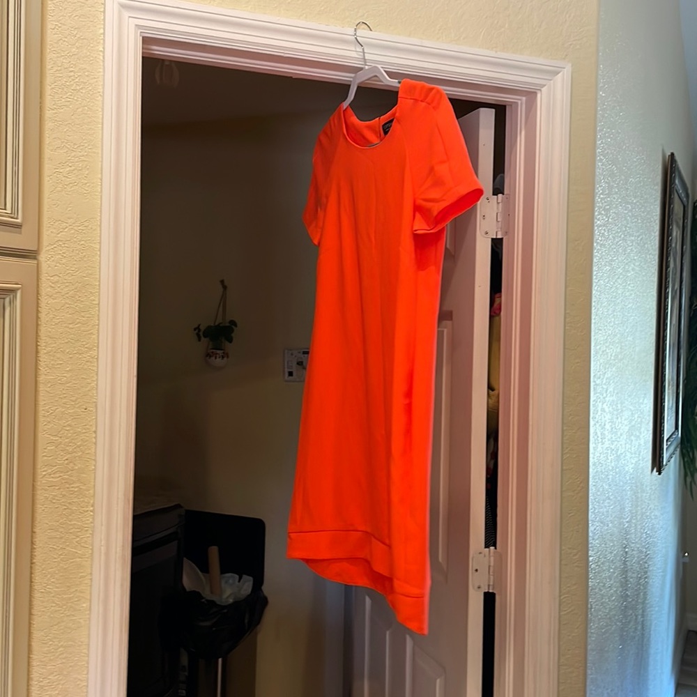 Super cute orange top shop dress with a great slimming fit!